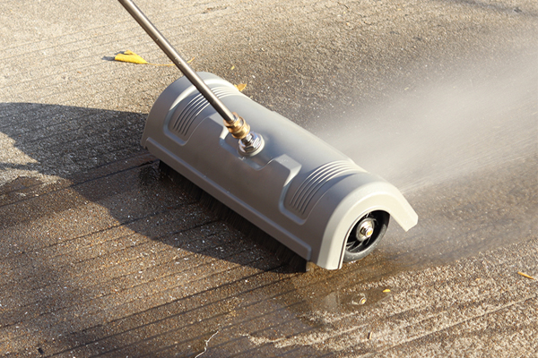 A person effortlessly pulling a new rectangular cleaning device with wheels