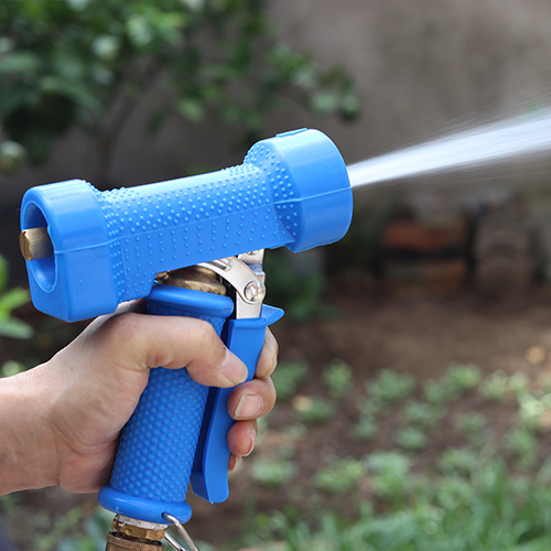 The nozzle's powerful jet stream cleaning a dirty surface