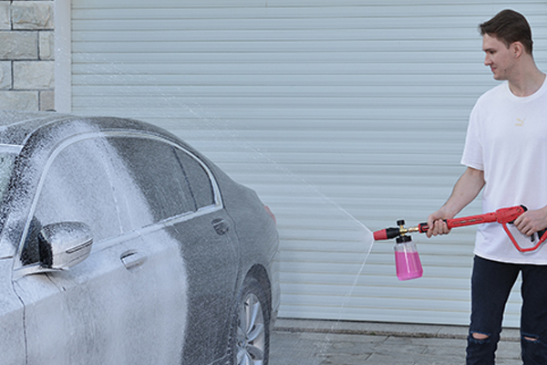 a close-up of incredibly thick foam clinging to the side of a car door