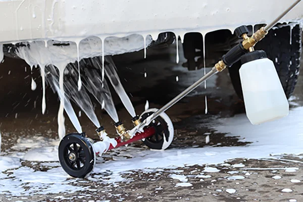 A foam cannon correctly spraying thick foam onto a car