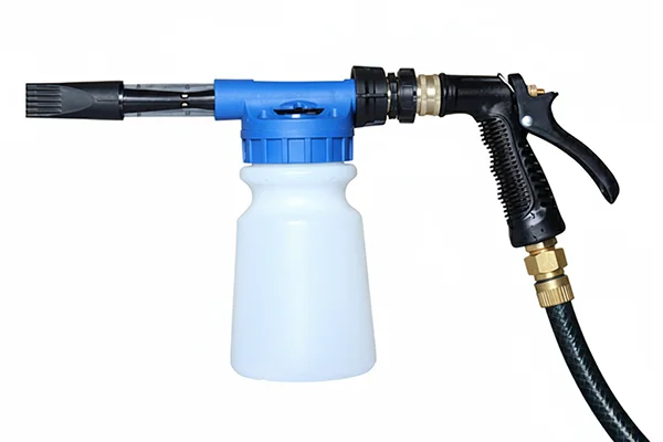 A garden hose connected to the back of a foam gun