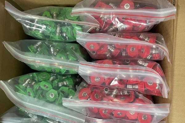 A set of colored pressure washer nozzles arranged neatly