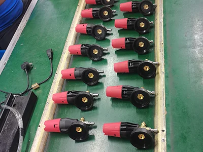 A modern factory floor showing production lines for cleaning tools