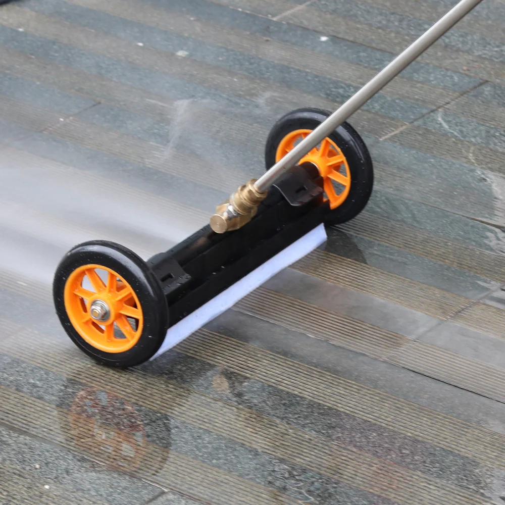 A person easily using a surface cleaner on a concrete patio